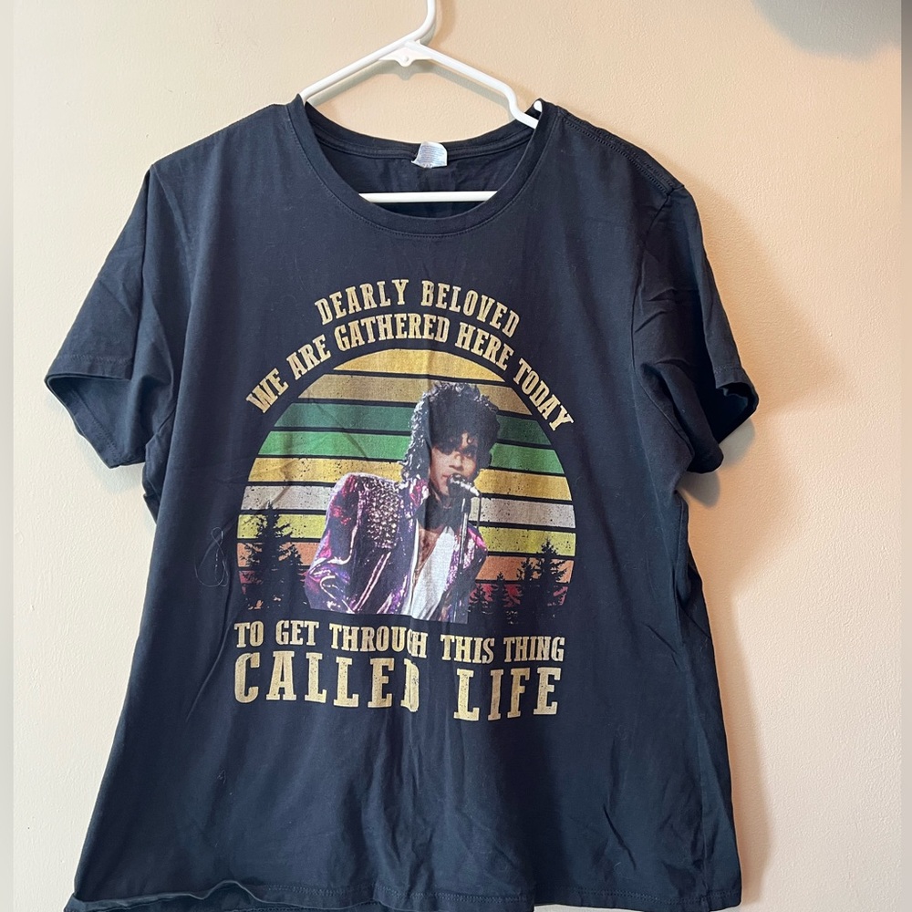 Prince T-shirt from Purple Rain made
By Port& Company, short sleeve. See measure